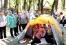 Миниатюра новости: Палатки, костры и дискотека: туристический слет пенсионеров «Зарница 25» прошел в Новороссийске